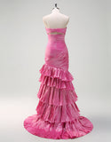 Robe de bal longue fuchsia à volants et décolleté en cœur avec fente